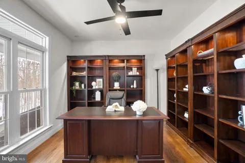 a kitchen with stainless steel appliances granite countertop a refrigerator a sink dishwasher and wooden cabinets with a stove