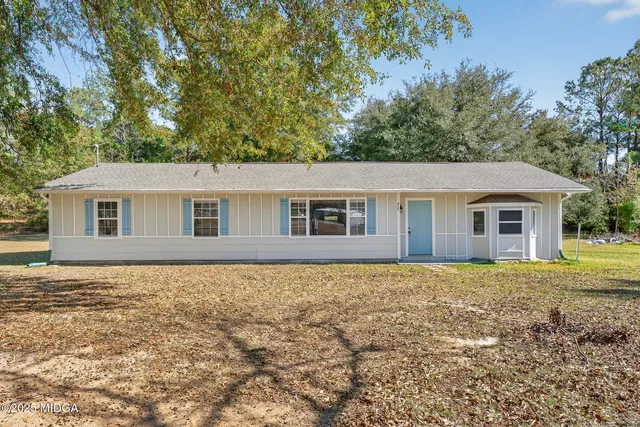 front view of a house with a yard