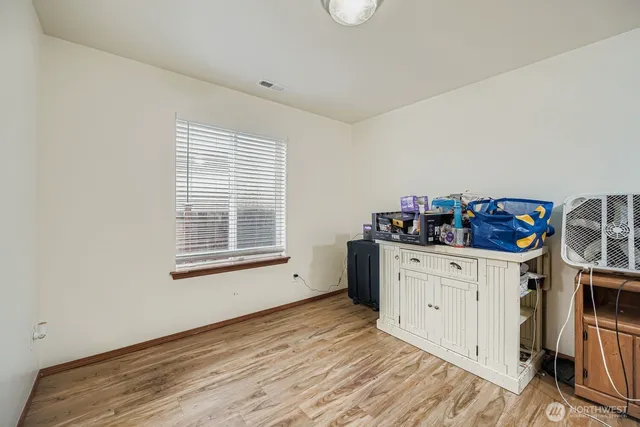a kitchen with granite countertop white cabinets and white appliances