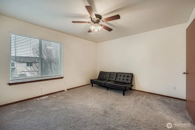 a view of an empty room with a window