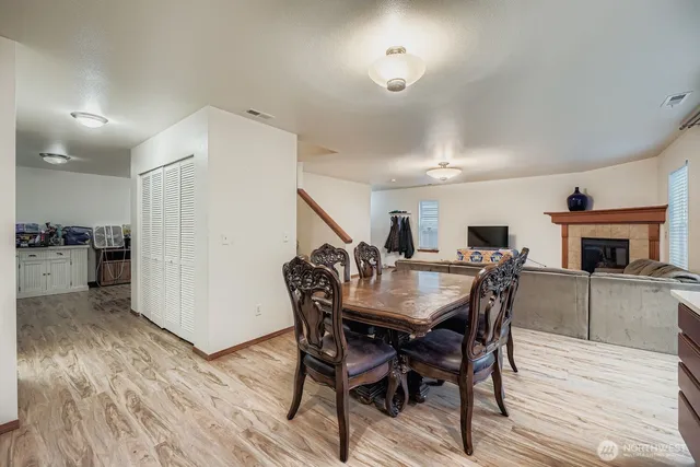 a view of a dining room with furniture and wooden floor