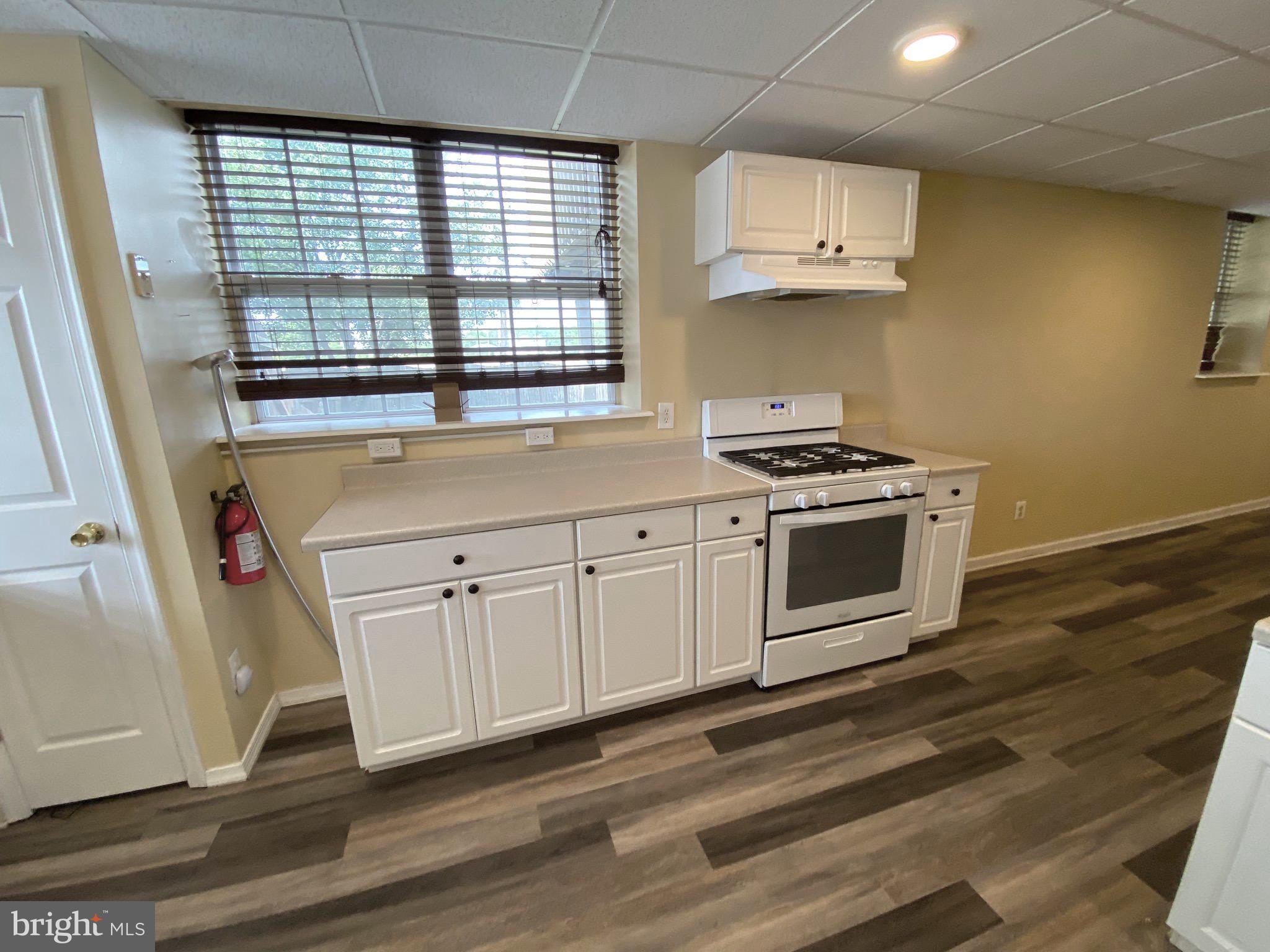 394 Croshaw Road, Unit B Wrightstown, NJ 08562 - Photo 2 of 16 a kitchen with stainless steel appliances white cabinets and a stove