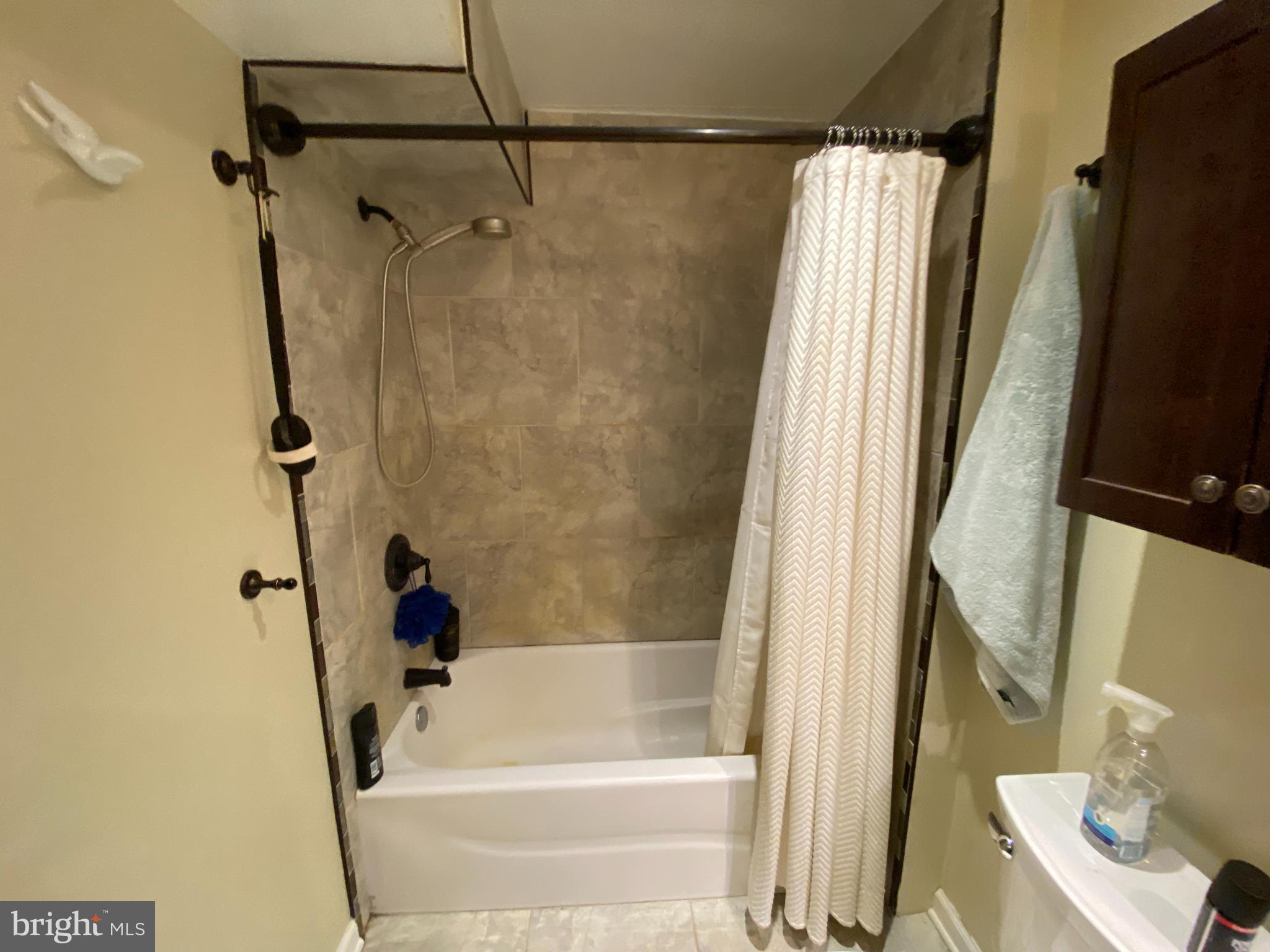 394 Croshaw Road, Unit B Wrightstown, NJ 08562 - Photo 7 of 16 a bathroom with a shower and a tub