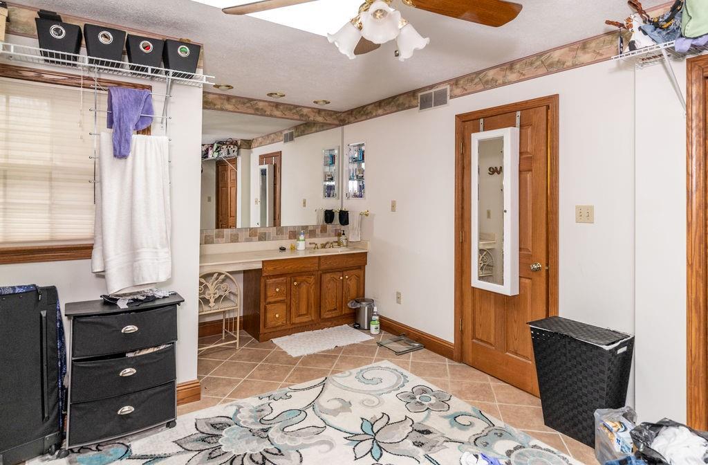 136 Dehaven Road Beaver Falls, PA 15010 - Photo 23 of 25 a bedroom with a bed and wooden cabinets