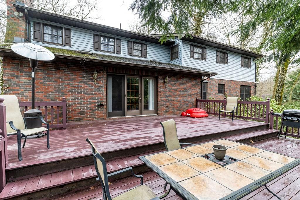 136 Dehaven Road Beaver Falls, PA 15010 - Photo 5 of 25 a view of a wooden chairs and table in the patio