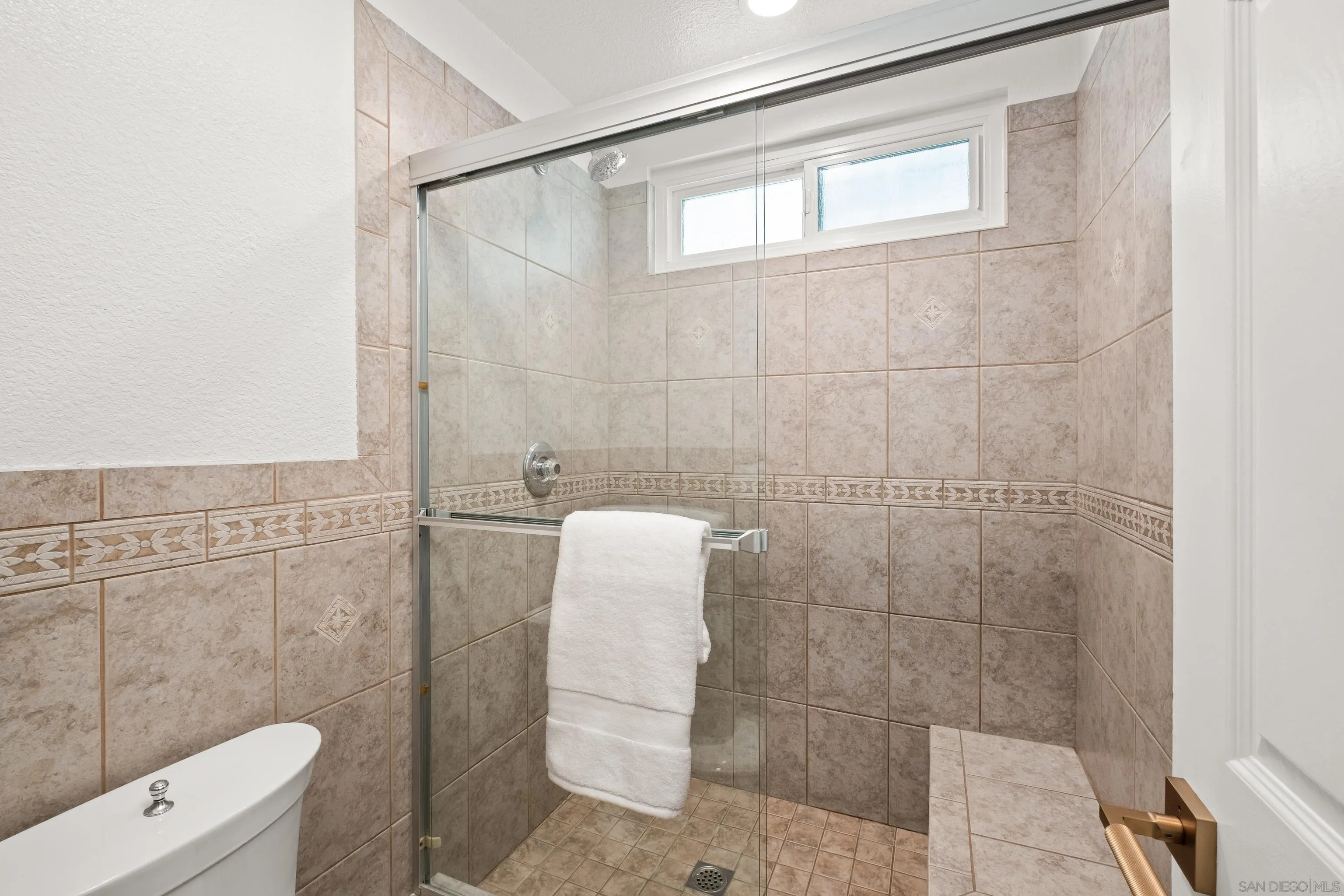11478 Madera Rosa Way San Diego, CA 92124 - Photo 37 of 54 a bathroom with a shower and a toilet