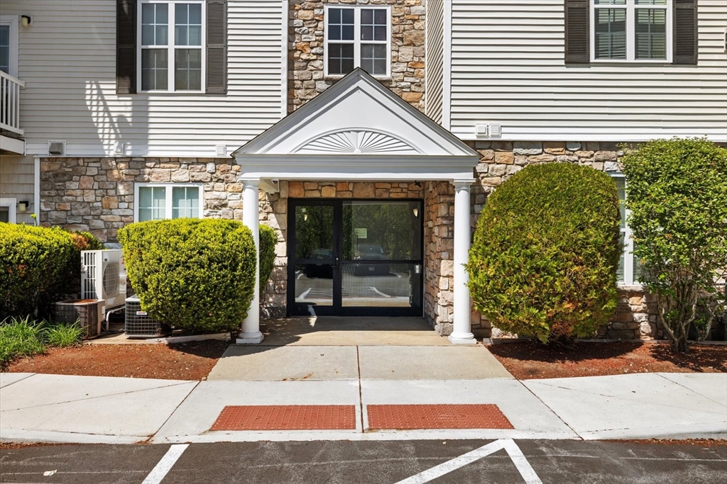 21 Hampshire Road, Unit 101 Methuen, MA 01844 - Photo 1 of 18 a front view of a house with garden