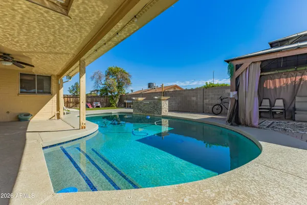 a view of a house with swimming pool