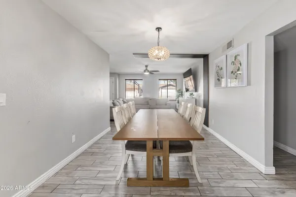 a view of a livingroom with a dinning table and chair