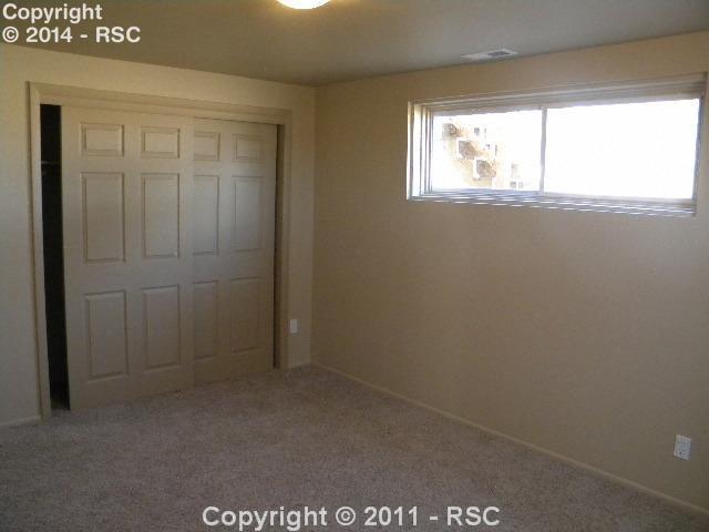 17075 Goshawk Road Colorado Springs, CO 80908 - Photo 10 of 16 Garden Level Bedroom 3