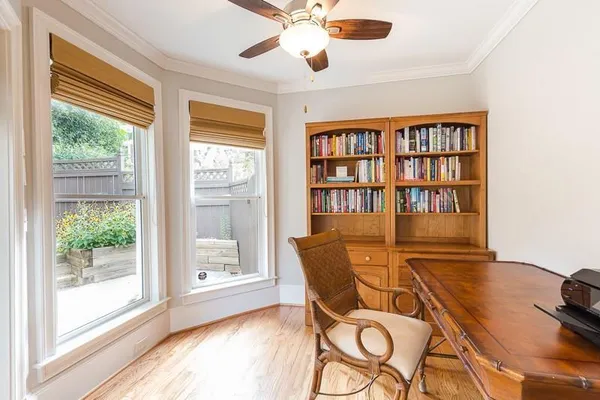 a workspace with furniture and a window