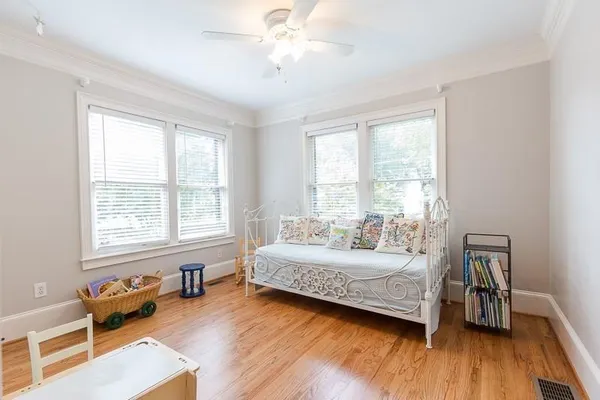 a bedroom with a bed and a couch