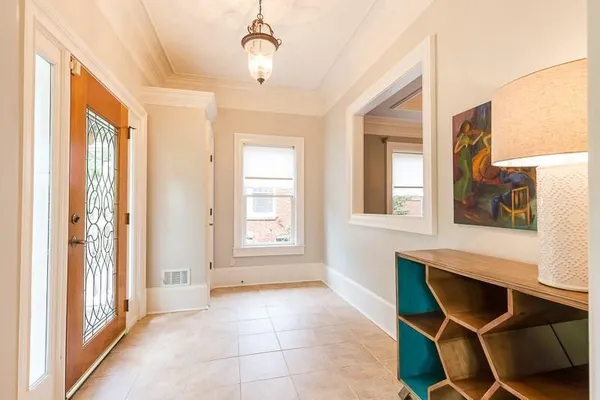 a view of a livingroom with furniture window and wooden floor