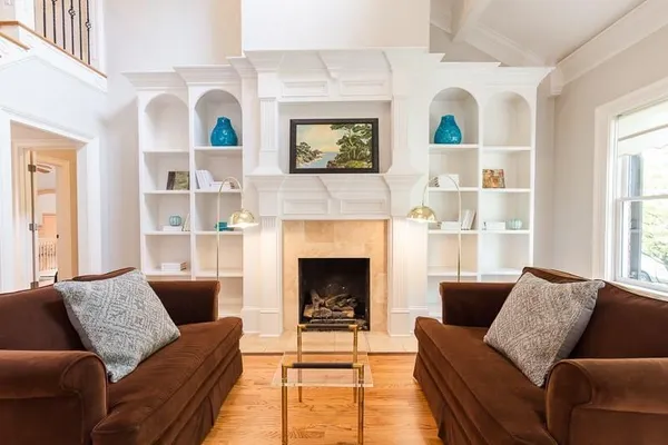 a living room with furniture and a fireplace