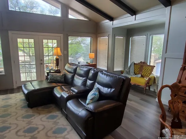 a living room with furniture and a window