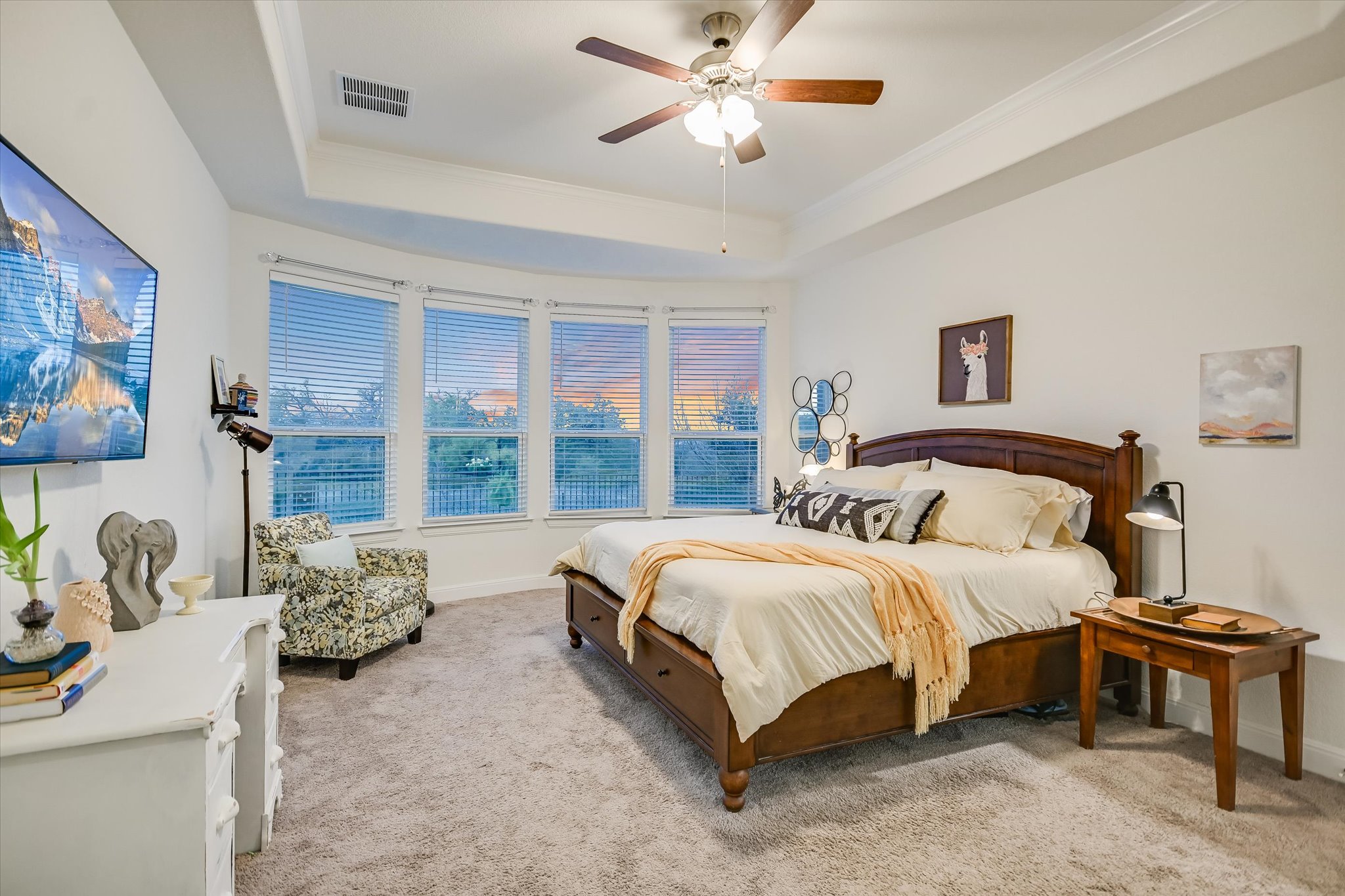 508 Peakside Circle Dripping Springs, TX 78620 - Photo 20 of 30 Bedroom with a raised ceiling, ceiling fan, light carpet, and ornamental molding