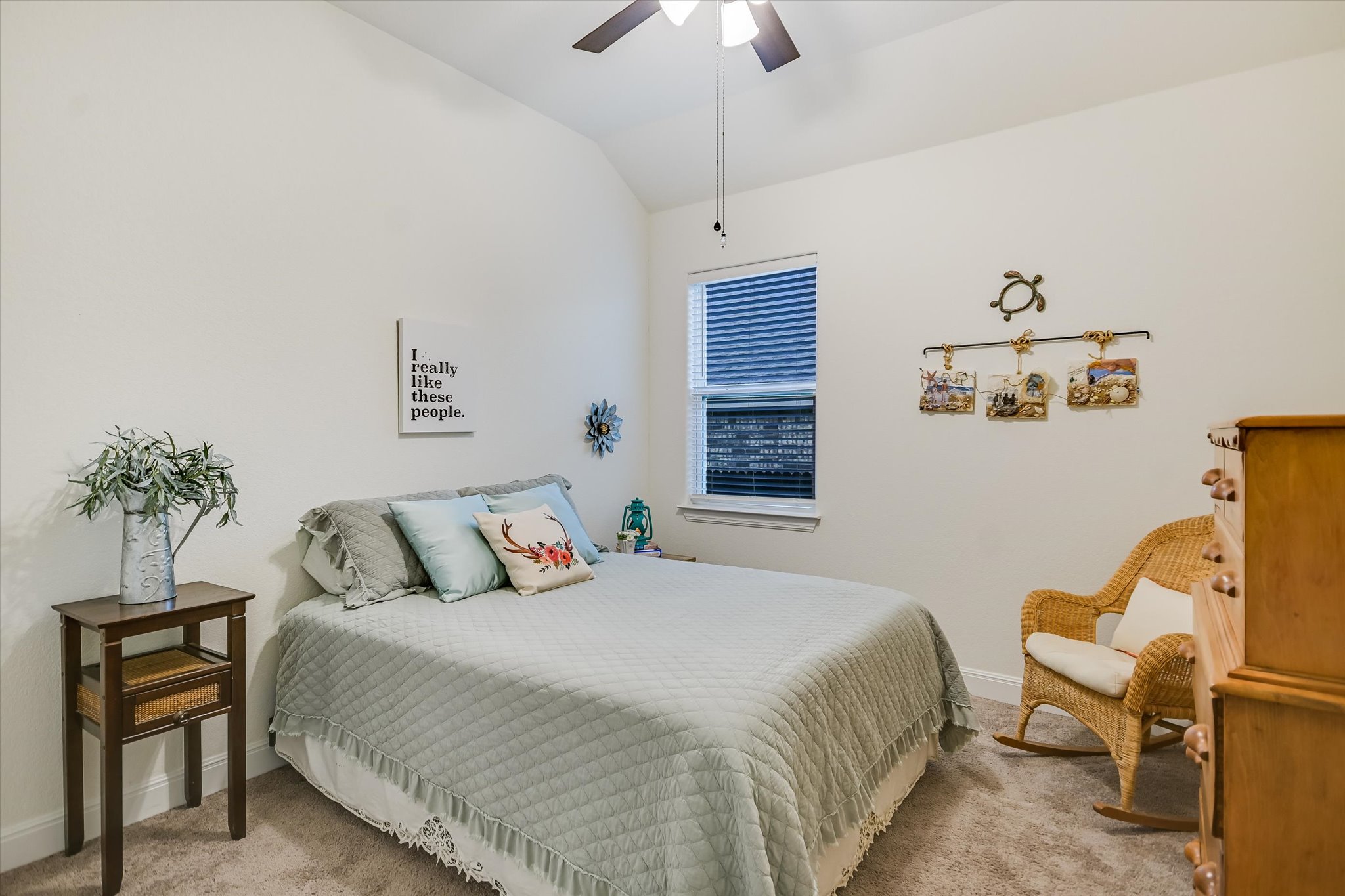 508 Peakside Circle Dripping Springs, TX 78620 - Photo 24 of 30 Bedroom with light colored carpet, vaulted ceiling, and a ceiling fan