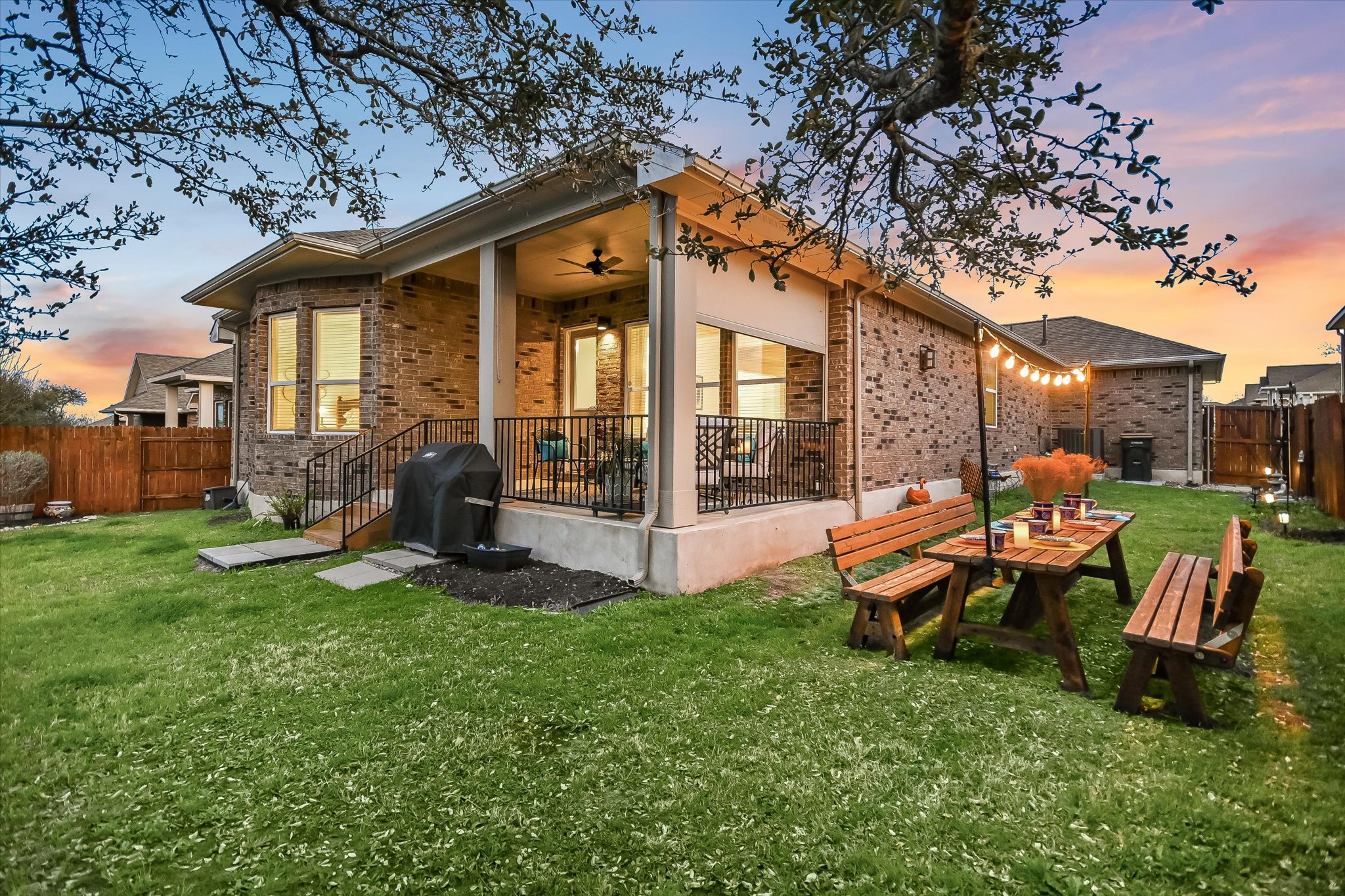 508 Peakside Circle Dripping Springs, TX 78620 - Photo 27 of 30 Rear view of property with a patio area, brick siding, and a ceiling fan