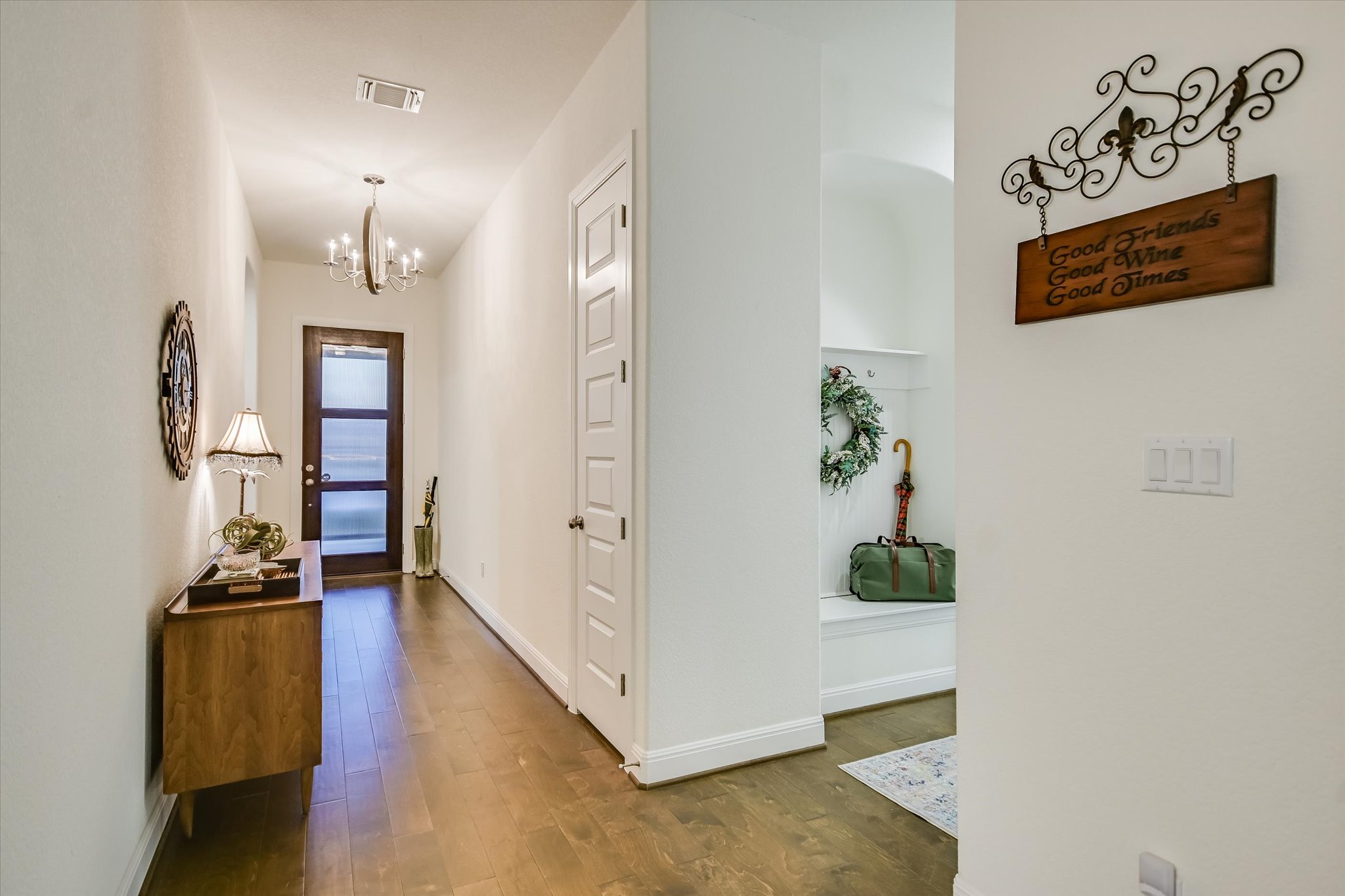 508 Peakside Circle Dripping Springs, TX 78620 - Photo 6 of 30 Hall with dark wood-style floors and suspended lighting