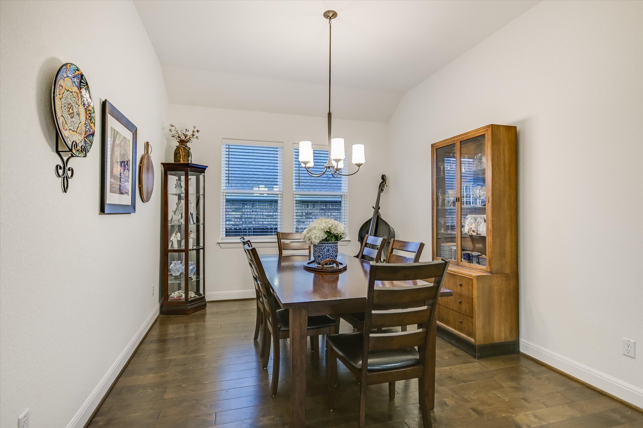 508 Peakside Circle Dripping Springs, TX 78620 - Photo 10 of 30 Dining room with dark wood-type flooring, vaulted ceiling, and suspended lighting