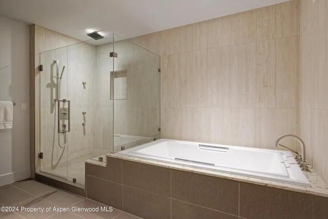 a bathroom with a bathtub and a sink