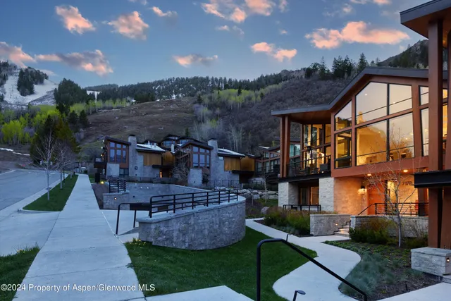 a view of an house with backyard and outdoor seating
