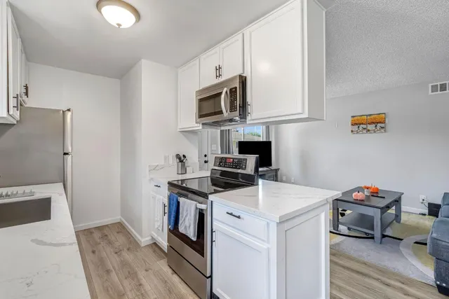 a view of kitchen and sink