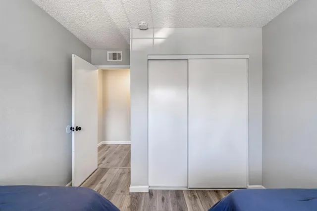 a view of room with wooden floor