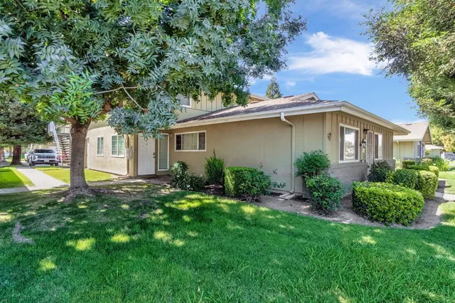 a house view with a garden space