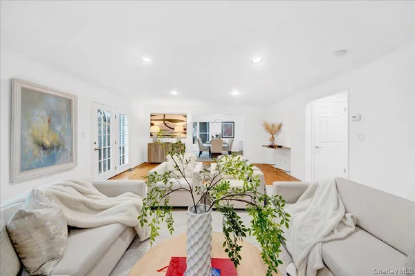 a living room with furniture flowers and flowers