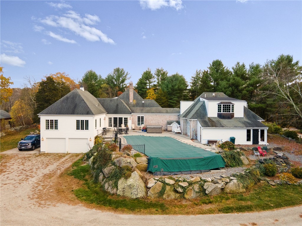 41 Johnson Road Foster, RI 02825 - Photo 2 of 49 Side patio with salt water infinity pool and hot tub. Additional two car garage.