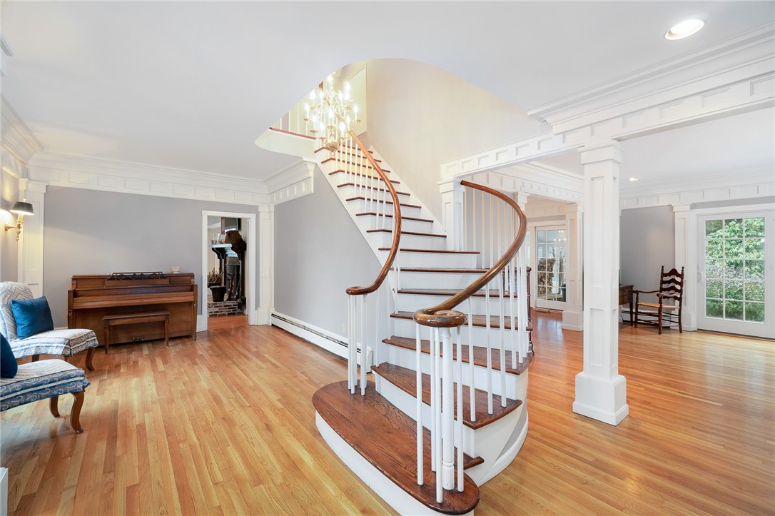41 Johnson Road Foster, RI 02825 - Photo 8 of 49 Elegant staircase leads to the second level and the largest of THREE primary en suite bedrooms