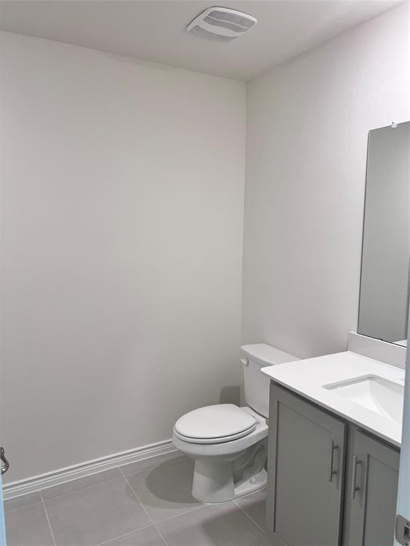 10313 Rambling Brks Lane Aubrey, TX 76227 - Photo 13 of 17 a white toilet sitting next to a white sink