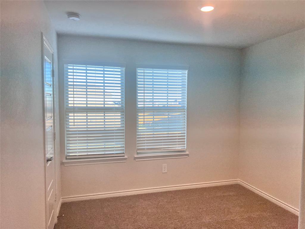 10313 Rambling Brks Lane Aubrey, TX 76227 - Photo 14 of 17 an empty room with a window