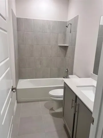 a bathroom with a sink a toilet and bathtub