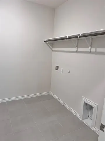 a kitchen with granite countertop a stove and a wooden floor