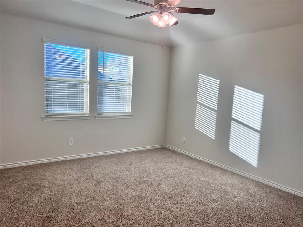 10313 Rambling Brks Lane Aubrey, TX 76227 - Photo 10 of 17 a view of an empty room with a window