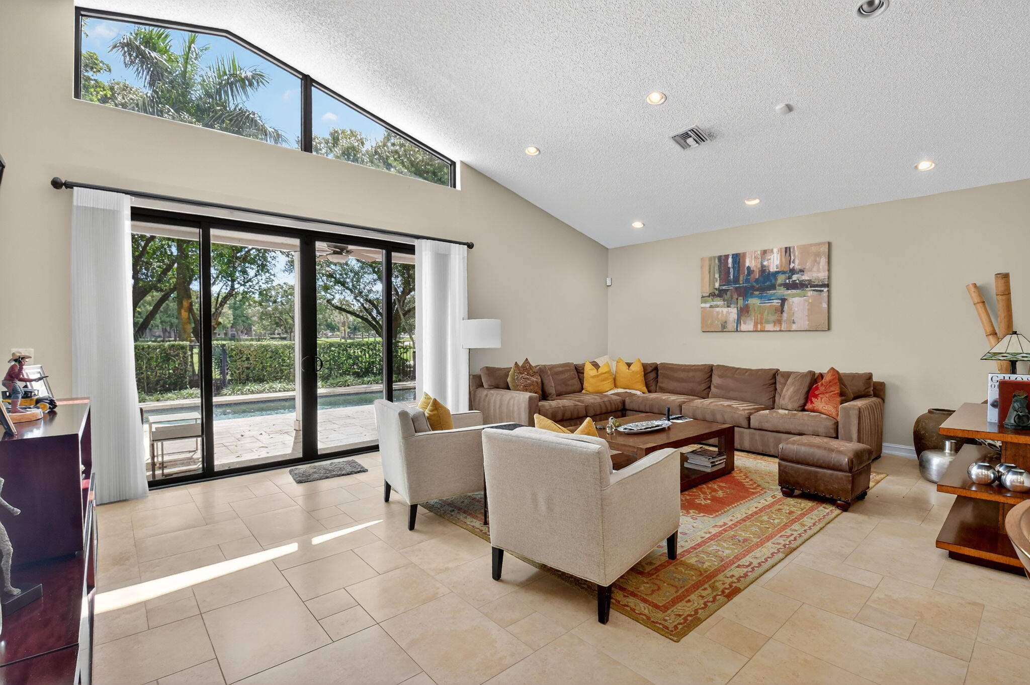 5850 Northwest 21st Avenue Boca Raton, FL 33496 - Photo 12 of 54 a living room with furniture and large windows