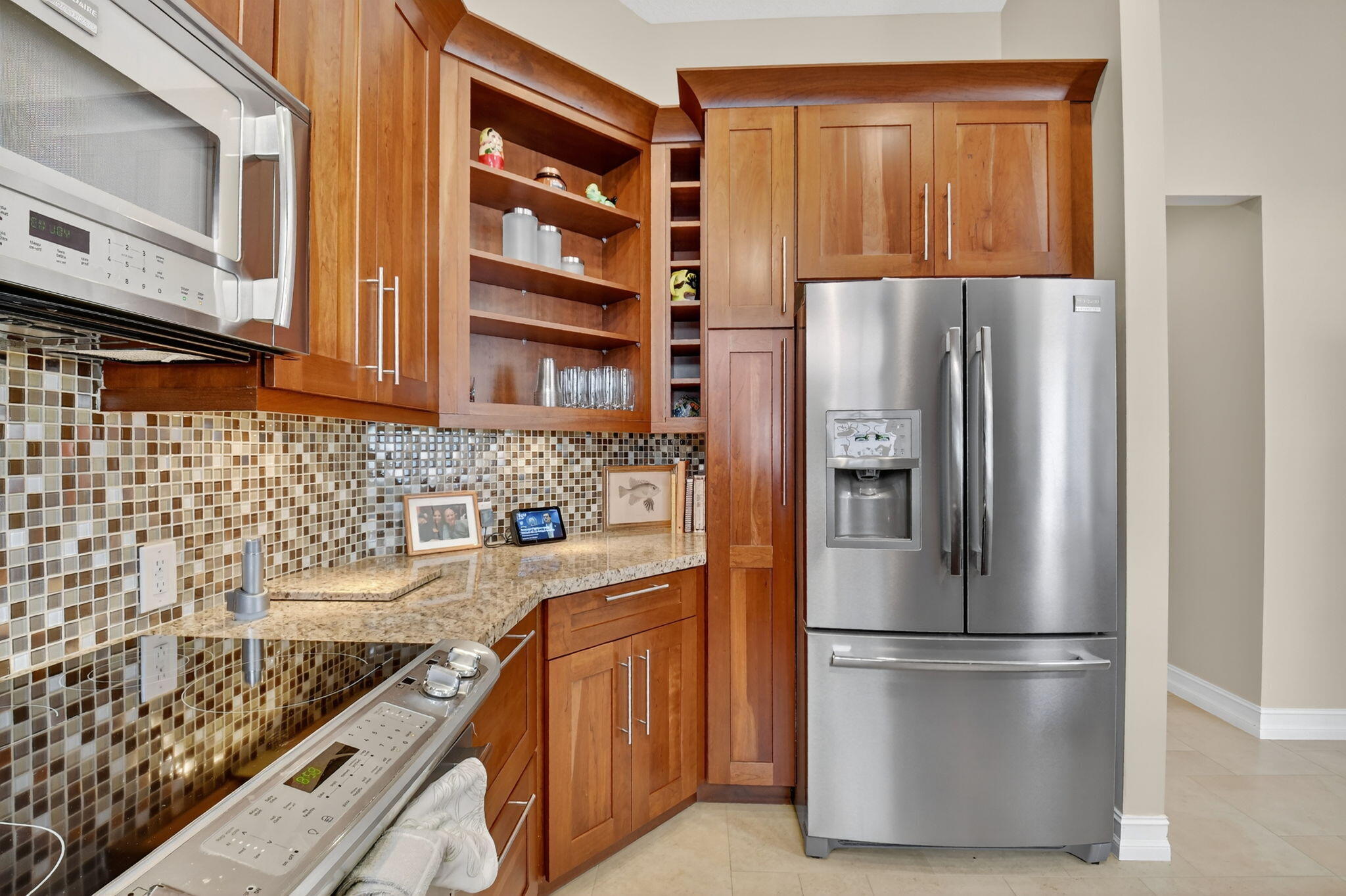5850 Northwest 21st Avenue Boca Raton, FL 33496 - Photo 21 of 54 a kitchen with stainless steel appliances granite countertop a refrigerator and a stove
