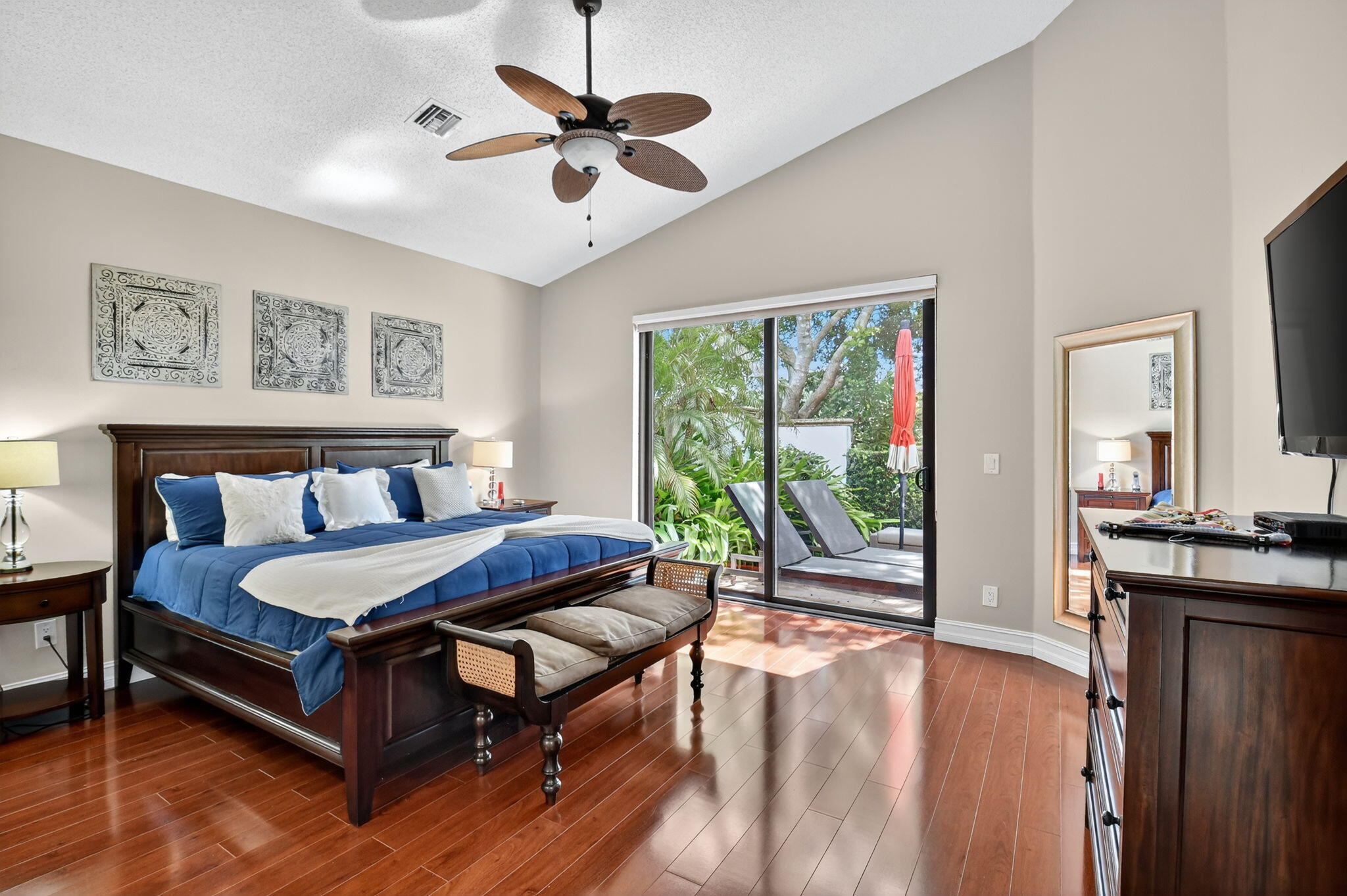 5850 Northwest 21st Avenue Boca Raton, FL 33496 - Photo 23 of 54 a bedroom with a bed and wooden floor