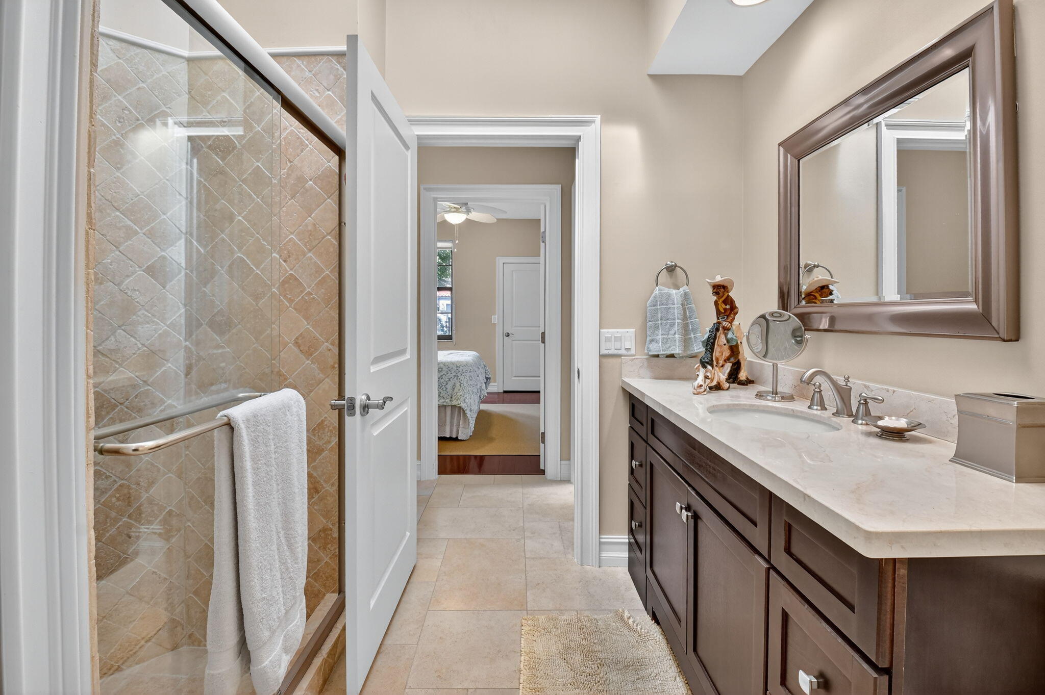 5850 Northwest 21st Avenue Boca Raton, FL 33496 - Photo 30 of 54 a bathroom with a double vanity sink a mirror and a shower