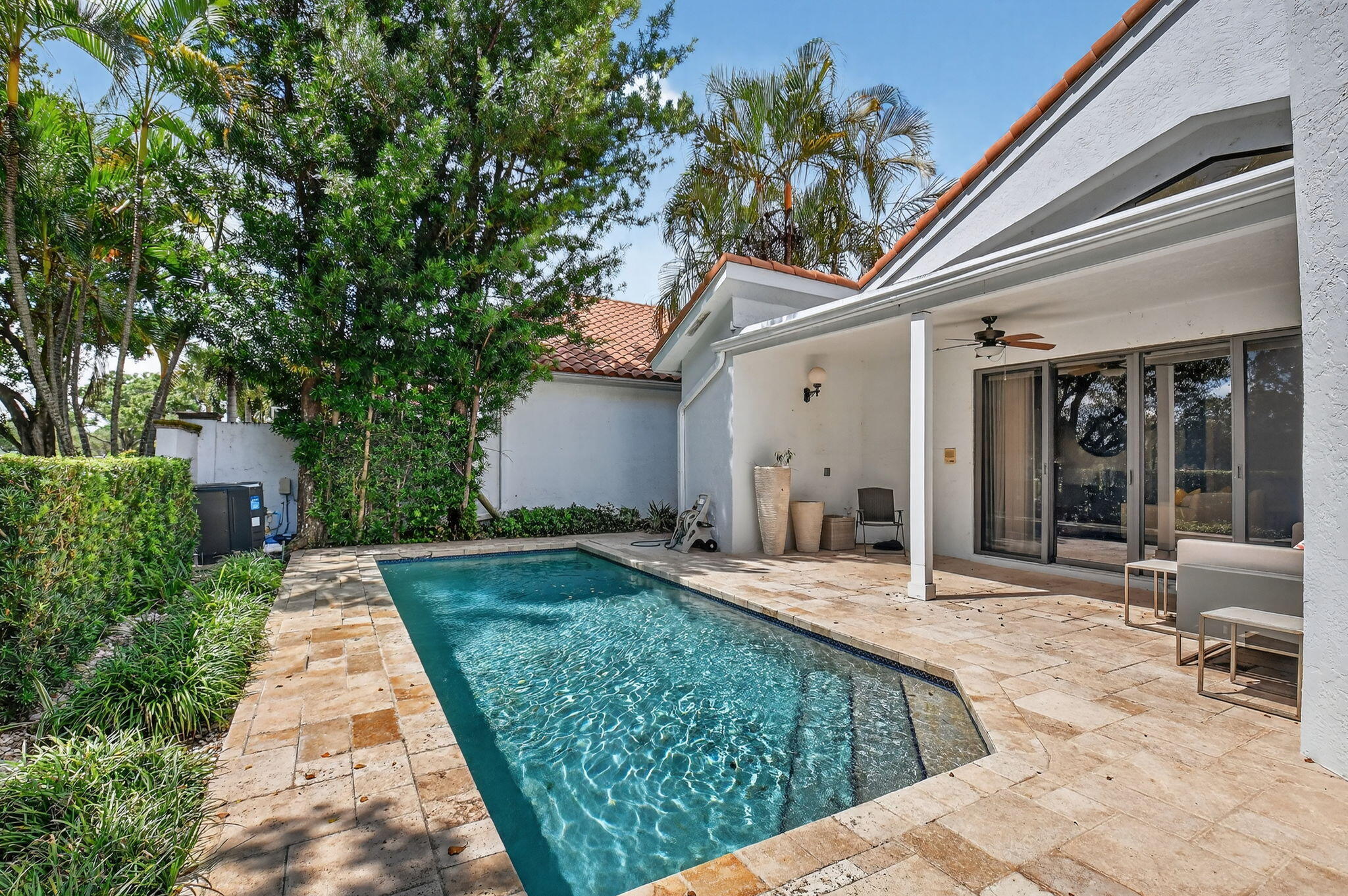 5850 Northwest 21st Avenue Boca Raton, FL 33496 - Photo 36 of 54 a view of a house with backyard porch and sitting area