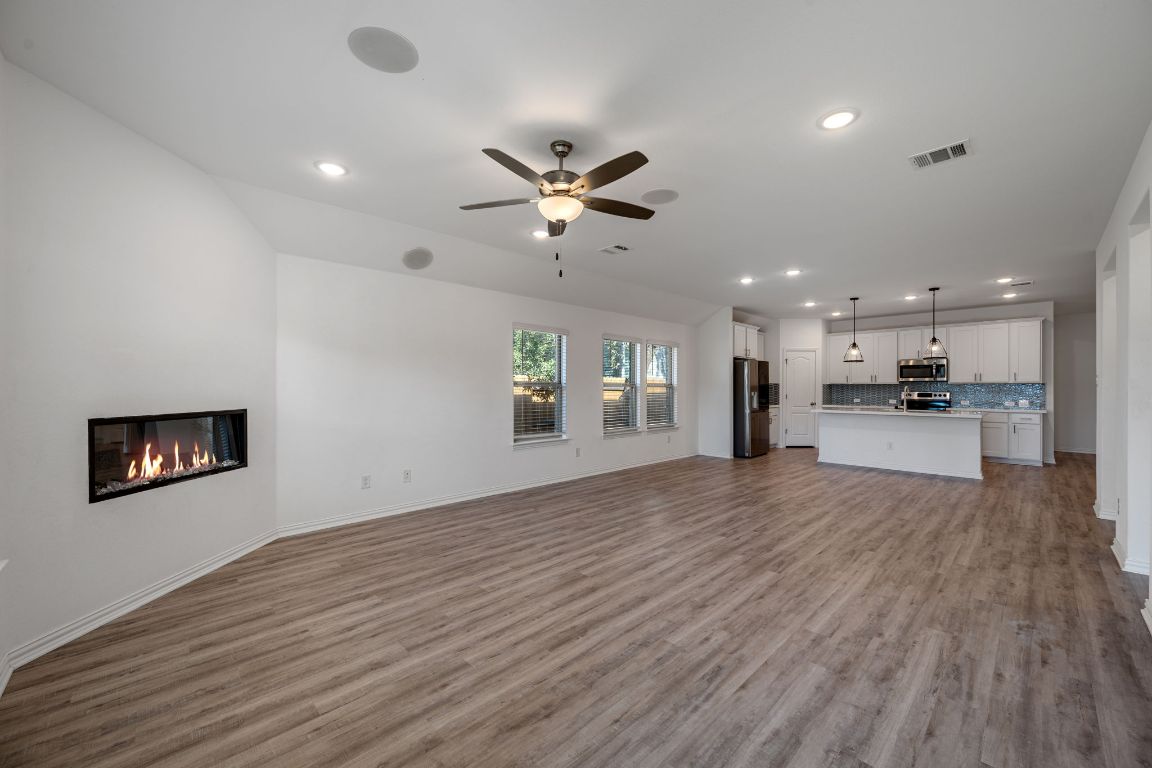 1109 Morning View Road Georgetown, TX 78628 - Photo 10 of 40 a view of an empty room with kitchen and a window