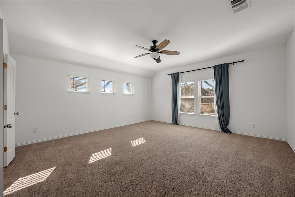 1109 Morning View Road Georgetown, TX 78628 - Photo 14 of 40 wooden floor in an empty room with a window