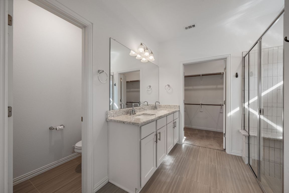 1109 Morning View Road Georgetown, TX 78628 - Photo 16 of 40 a kitchen with a sink appliances and cabinets