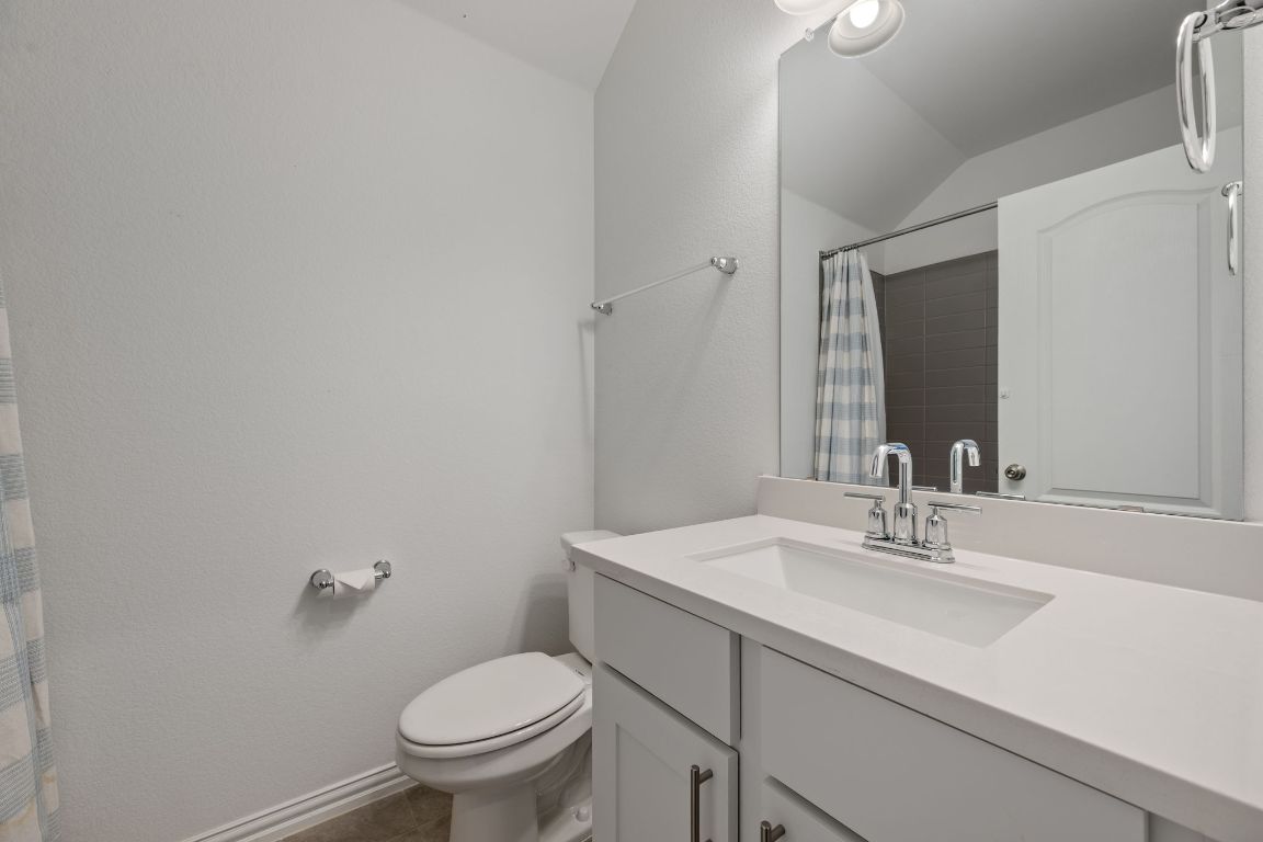 1109 Morning View Road Georgetown, TX 78628 - Photo 20 of 40 a bathroom with a sink toilet and a mirror