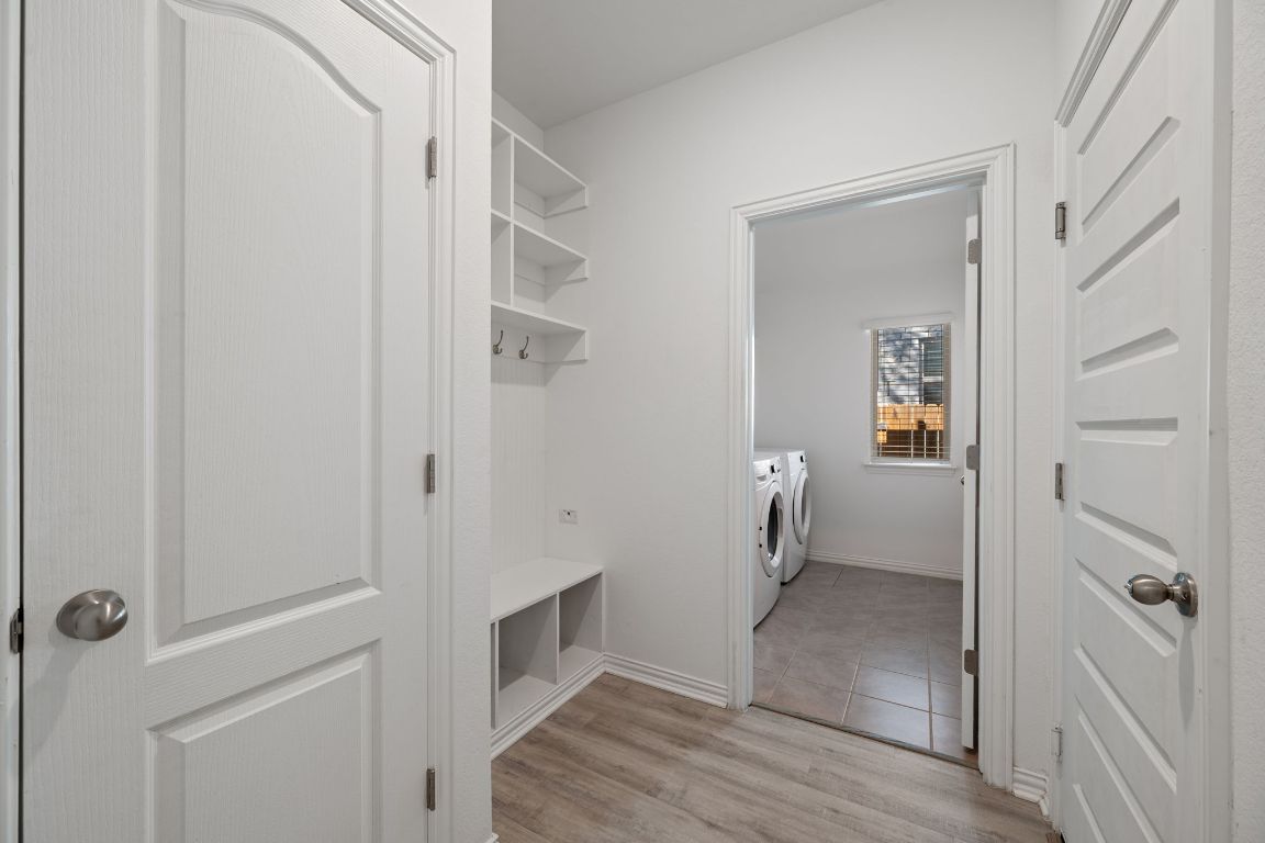 1109 Morning View Road Georgetown, TX 78628 - Photo 24 of 40 a view of a hallway with wooden floor and closet
