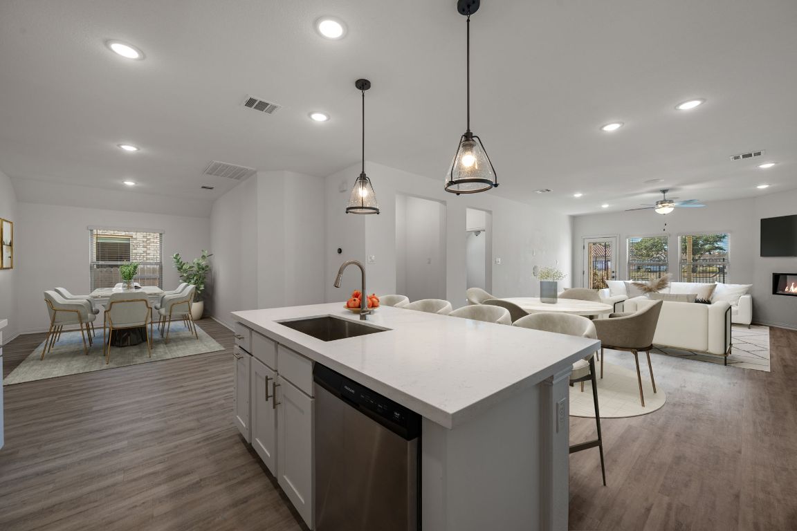 1109 Morning View Road Georgetown, TX 78628 - Photo 37 of 40 a kitchen with a table chairs sink and wooden floor