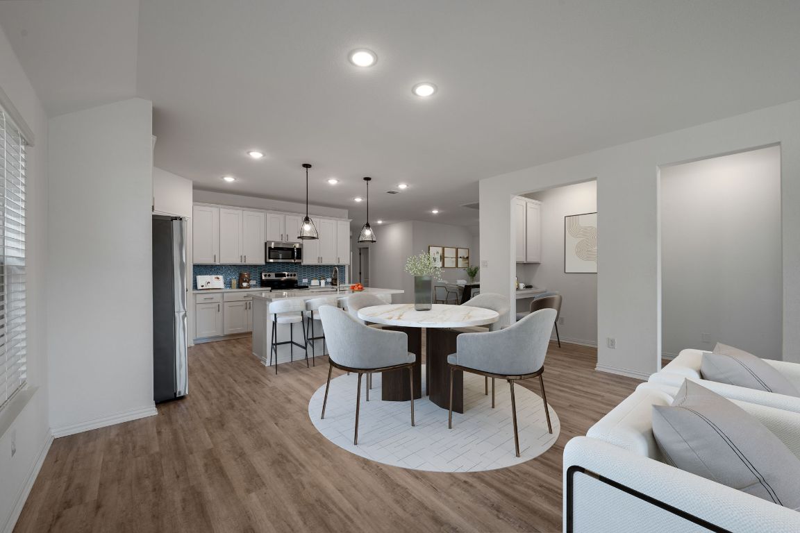 1109 Morning View Road Georgetown, TX 78628 - Photo 7 of 40 a view of a dining room with furniture and wooden floor