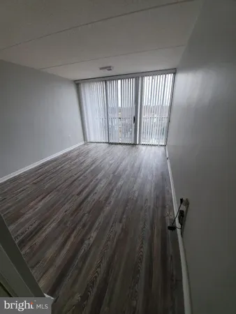 wooden floor in a hall with an entryway